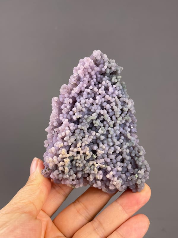 Grape Agate from Indonesia: upright outline with mixed pale colors.