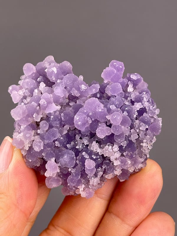 Grape Agate from Indonesia: front close view of varied purple nodule sizes.