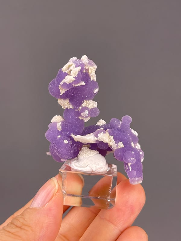 Grape Agate from Indonesia: reverse profile with scattered white crystalline patches.