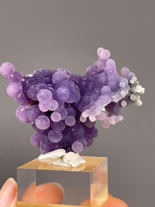 Grape Agate from Indonesia: back view with small pale growths at the edge.