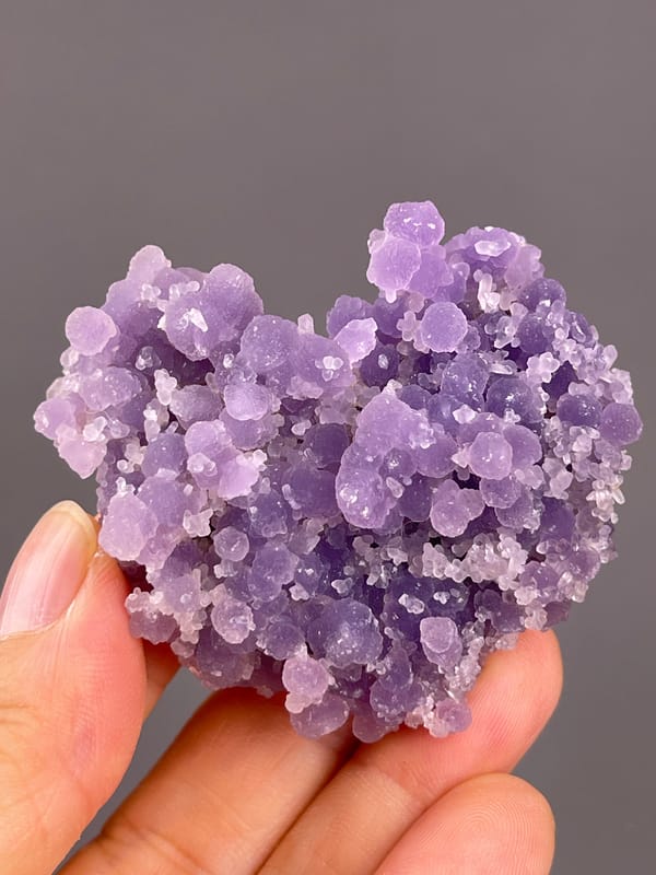 Grape Agate from Indonesia: oblique view showing the curved upper outline.