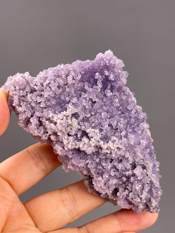 Grape Agate from Indonesia: purple granular surface in an oblique view.