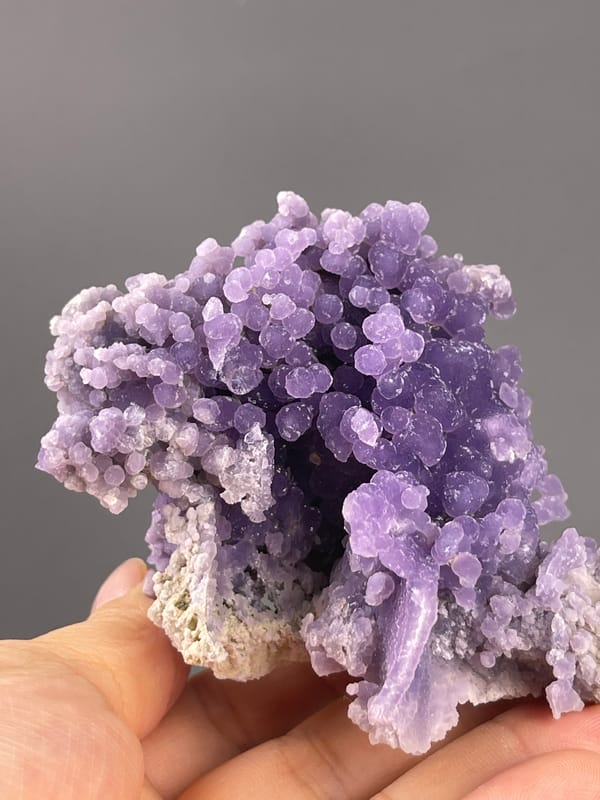 Grape Agate from Indonesia: larger violet spheres with fine sparkling surfaces.