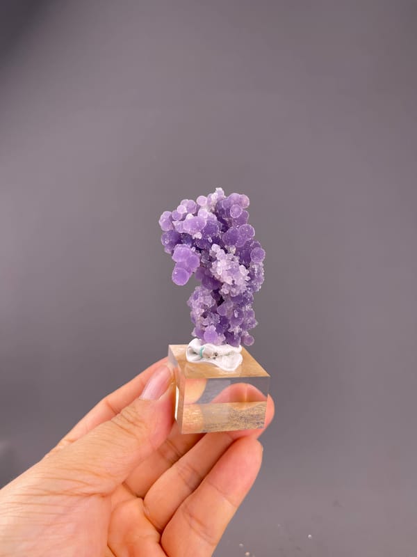 Grape Agate from Indonesia: whole upright specimen on its display base.