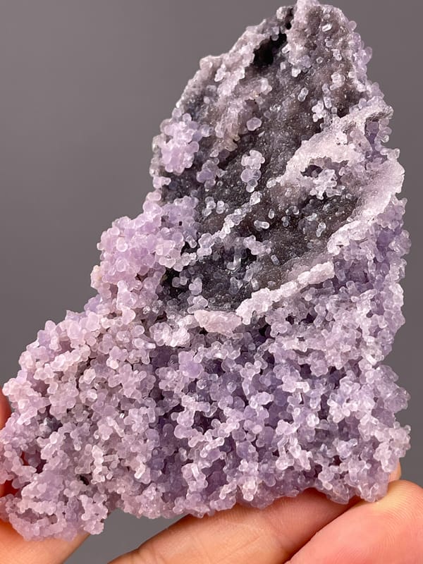 Grape Agate from Indonesia: deep hollow framed by pale nodules.