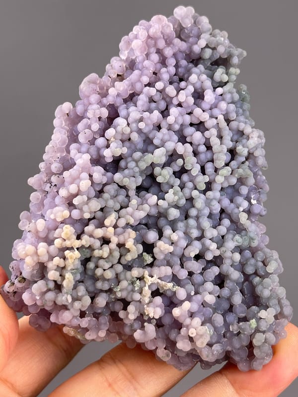 Grape Agate from Indonesia: upright face with scattered greenish areas.