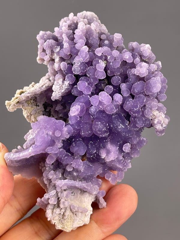 Grape Agate from Indonesia: reverse angle showing pale matrix and purple lobes.