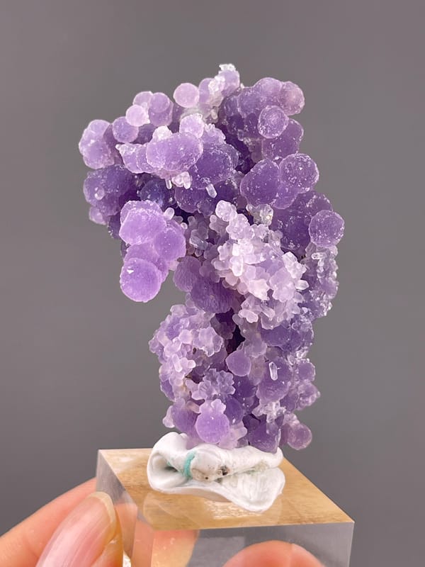 Grape Agate from Indonesia: close front view of rounded violet growths.