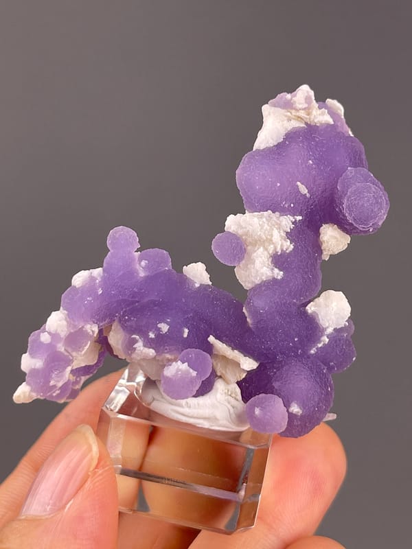 Grape Agate from Indonesia: front angle with pale patches on purple lobes.
