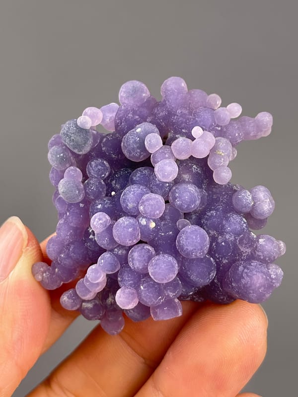 Grape Agate from Indonesia: close frontal view of dense violet rounded growths.