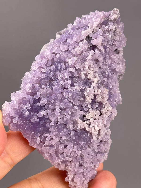 Grape Agate from Indonesia: narrow upper edge and purple rounded growths.