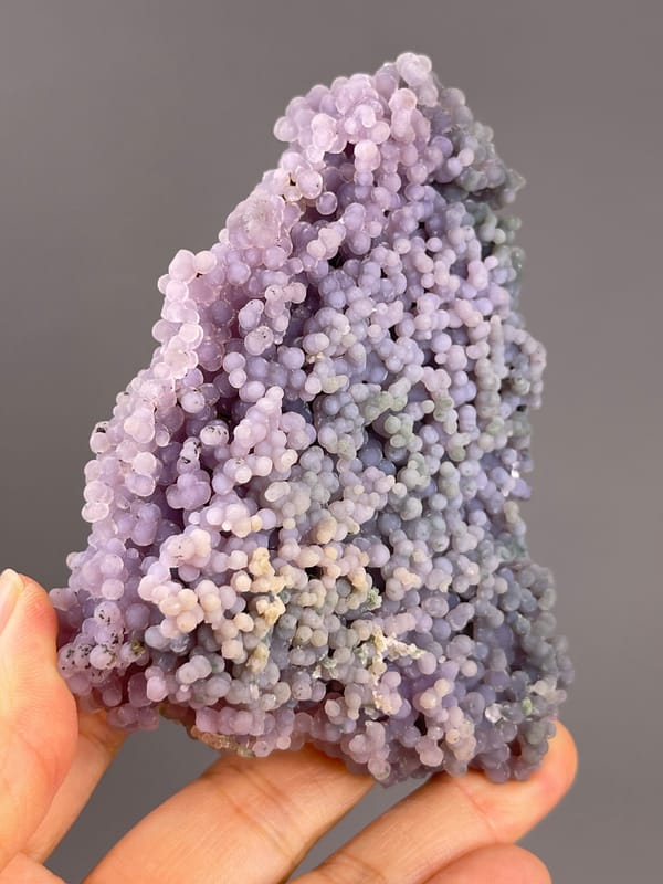 Grape Agate from Indonesia: oblique view of the tapered purple cluster.