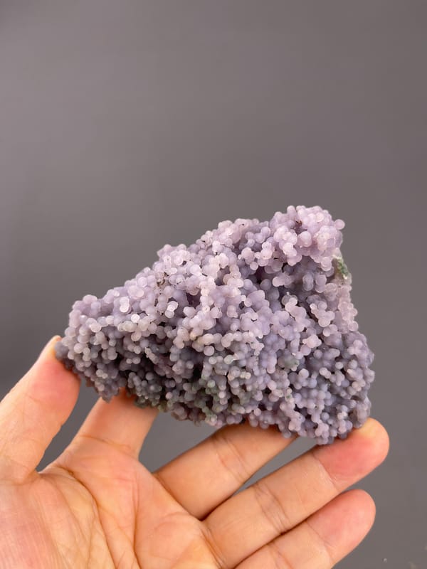 Grape Agate from Indonesia: broad lower surface with mixed pale nodules.