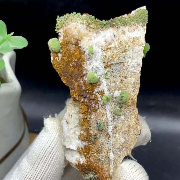 Green pyromorphite balls on tall rusty plate from Guangxi, China