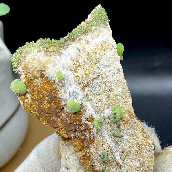 Green pyromorphite balls on tall rusty plate from Guangxi, China, view 3 of 9