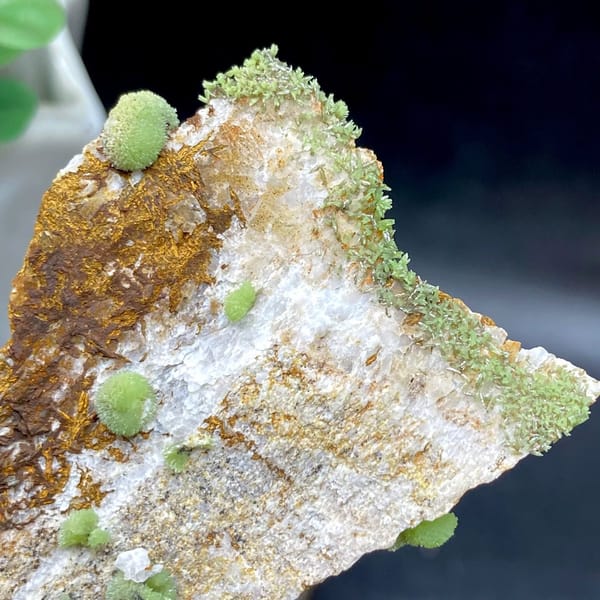 Green pyromorphite balls on tall rusty plate from Guangxi, China, view 5 of 9