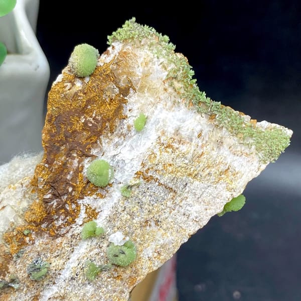 Green pyromorphite balls on tall rusty plate from Guangxi, China, view 7 of 9