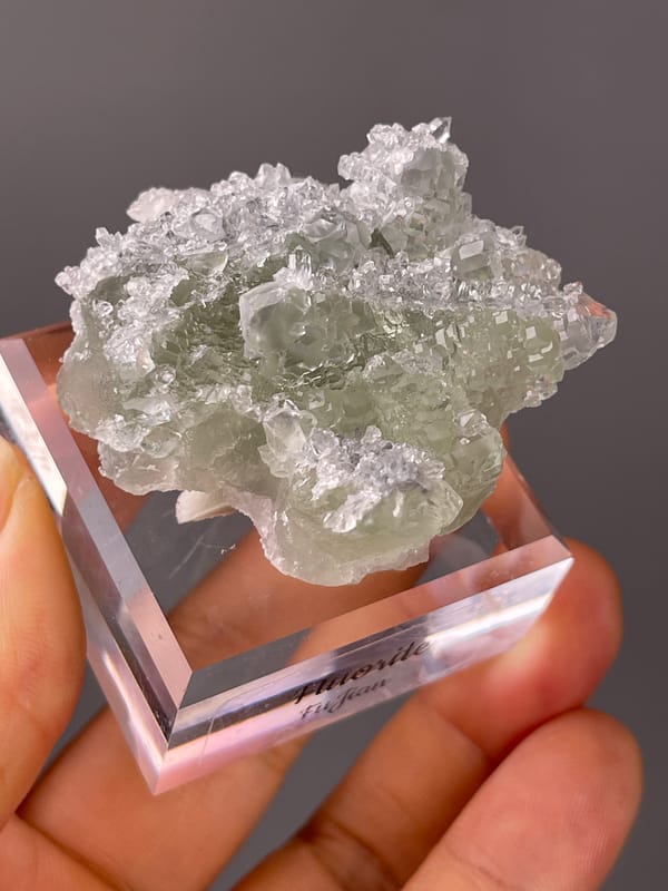 Green Fluorite on Quartz specimen from Fujian, China presenting pale green fluorite cubes on clear quartz