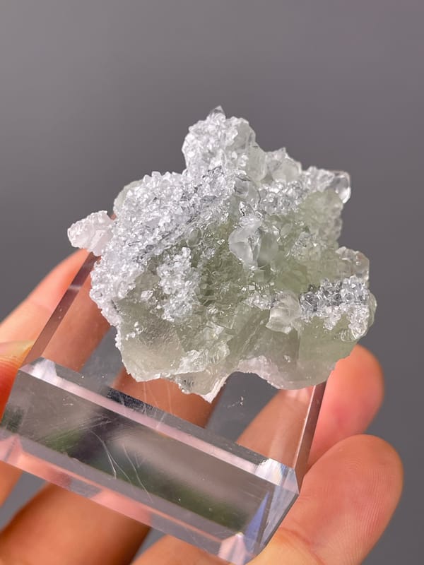 Green Fluorite on Quartz specimen from Fujian, China displaying pale green fluorite cubes on clear quartz