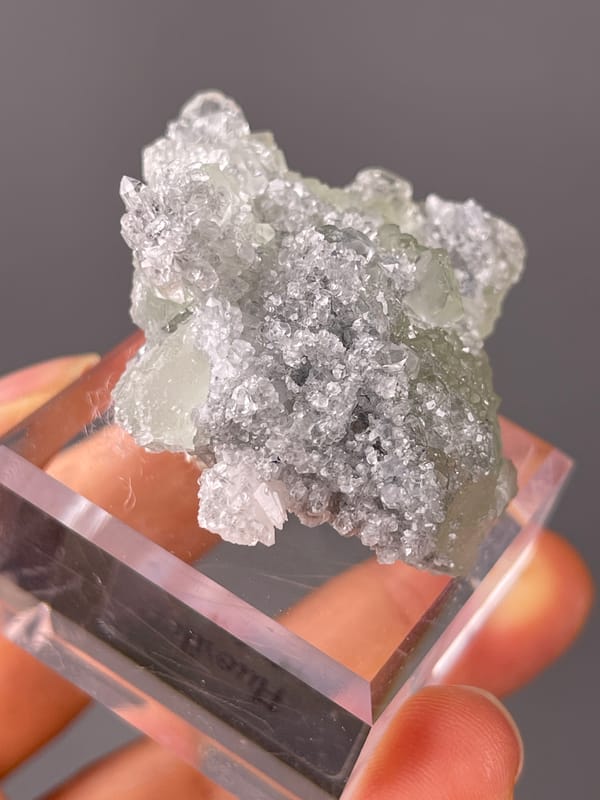 Pale green fluorite cubes on clear quartz druse on natural Green Fluorite on Quartz specimen from
