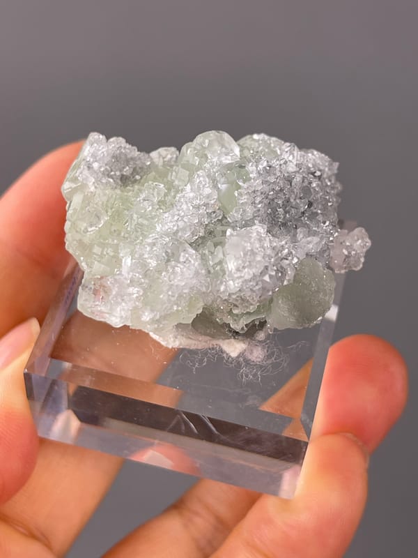 Green Fluorite on Quartz specimen from Fujian, China bearing pale green fluorite cubes on clear quartz