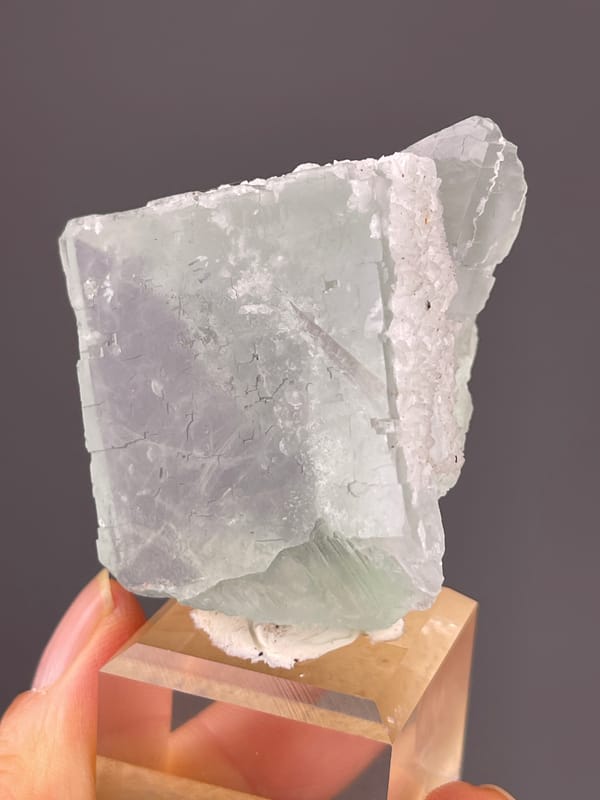Green Fluorite specimen from Zhejiang, China presenting pale green cube with frosted edge