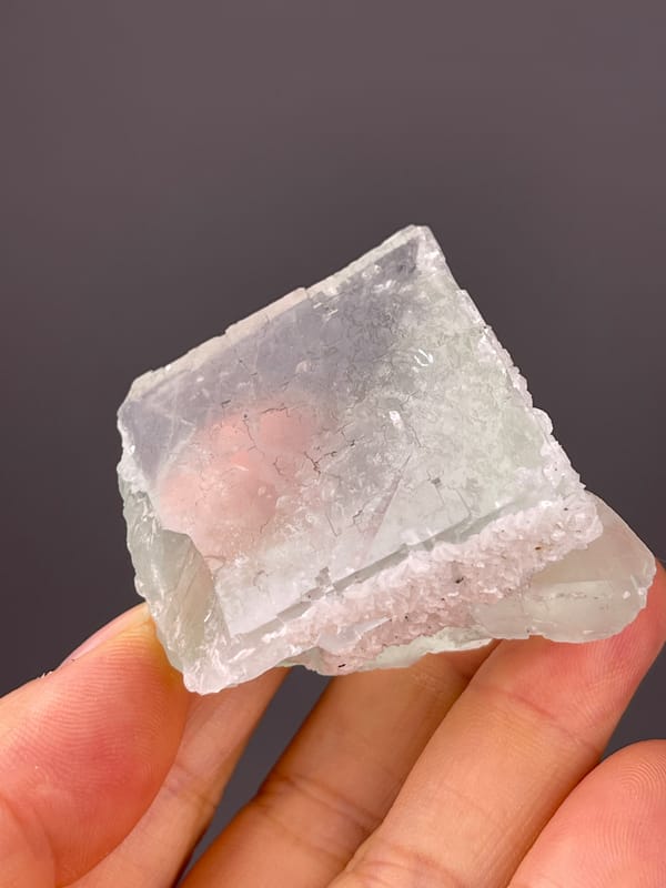 Green Fluorite specimen from Zhejiang, China bearing pale green cube with frosted edge