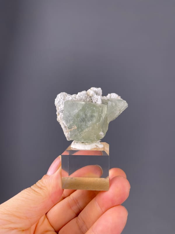 Green Fluorite specimen from Fujian, China featuring pale green fluorite and white microcrystals