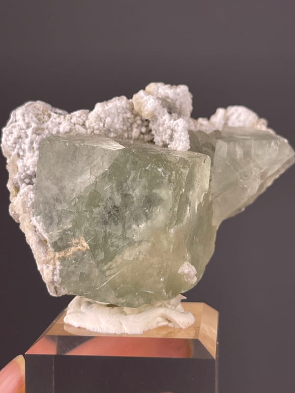 Green Fluorite specimen from Fujian, China showing pale green fluorite and white microcrystals