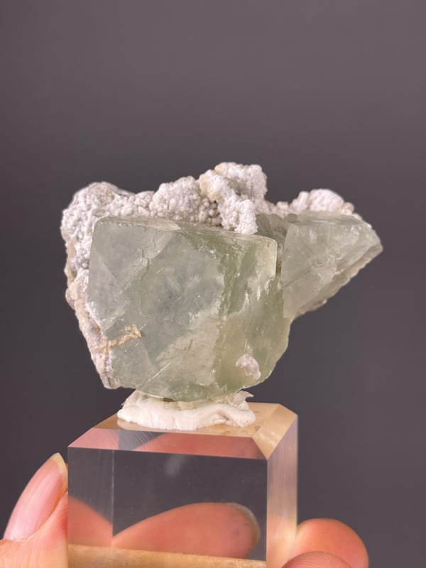 Green Fluorite specimen from Fujian, China presenting pale green fluorite and white microcrystals