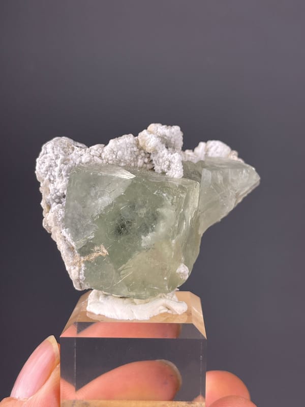 Pale green fluorite and white microcrystals visible on green fluorite specimen from Fujian, China
