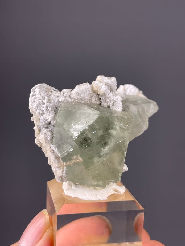 Green Fluorite specimen from Fujian, China displaying pale green fluorite and white microcrystals
