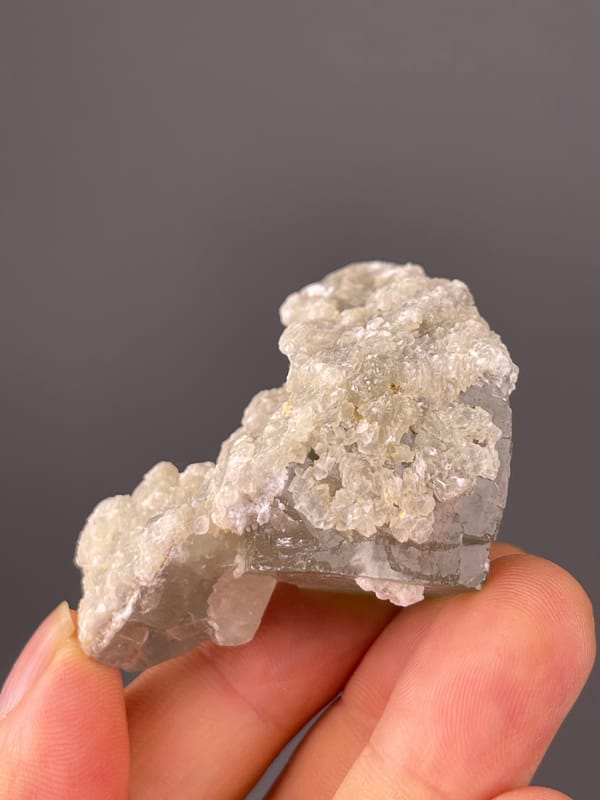 Green Fluorite specimen from Fujian, China, characterized by pale green fluorite and white microcrystals