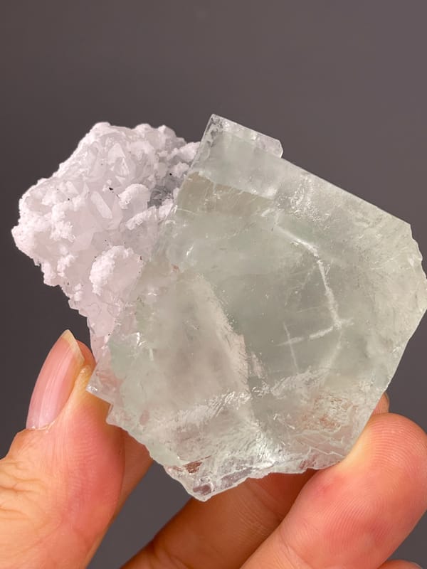 Green Fluorite specimen from Zhejiang, China highlighting pale green cube with white cluster