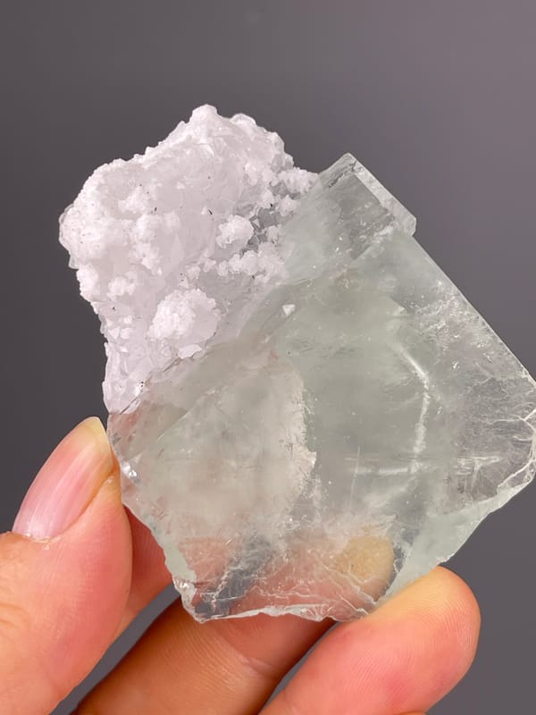 Green Fluorite specimen from Zhejiang, China, characterized by pale green cube with white cluster