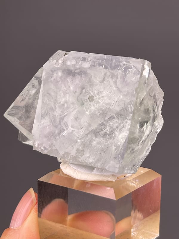 Green Fluorite specimen from Xianghualing, Hunan, China displaying intergrown colorless cubic crystals