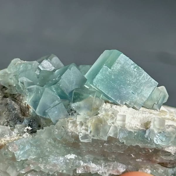Colour-change fluorite cubes shifting green to blue from Xianghualing, Hunan, China, view 5 of 11