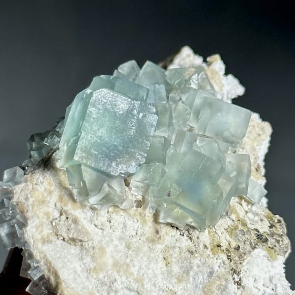 Colour-change fluorite cubes shifting green to blue from Xianghualing, Hunan, China, view 8 of 11