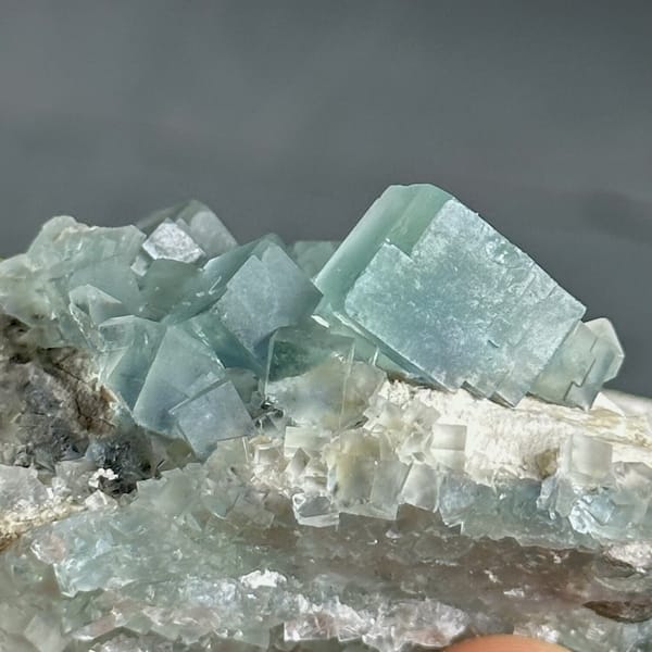 Colour-change fluorite cubes shifting green to blue from Xianghualing, Hunan, China, view 9 of 11