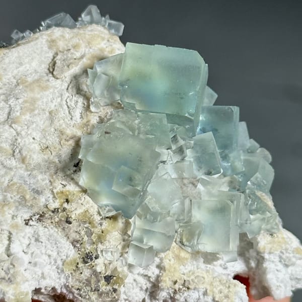 Colour-change fluorite cubes shifting green to blue from Xianghualing, Hunan, China, view 11 of 11