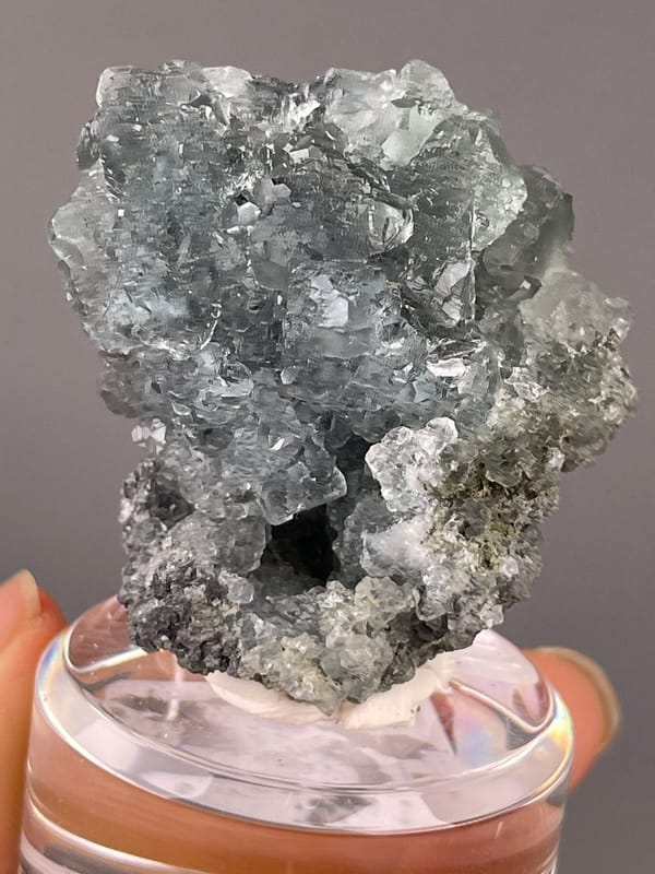 Pale blue-gray octahedral cluster on natural green octahedral fluorite specimen from Fujian, China