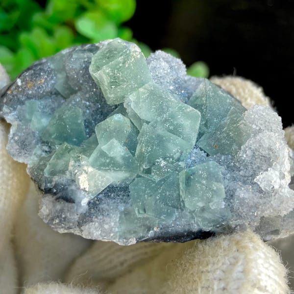 Sea-green fluorite octahedra clustered on grey rock from Hunan, China, view 5 of 9