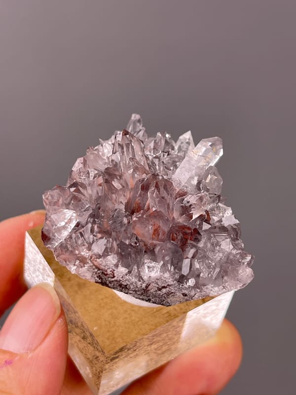 Mauve quartz prisms with red inclusions visible on hematite-included quartz specimen from Longyan, Fujian, China