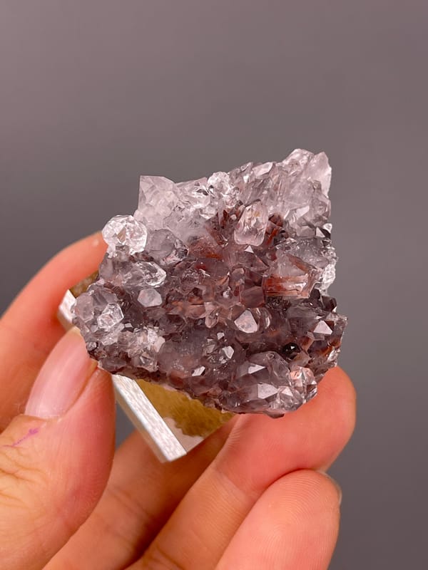 Mauve quartz prisms with red inclusions on natural hematite-included quartz specimen from Longyan, Fujian, China