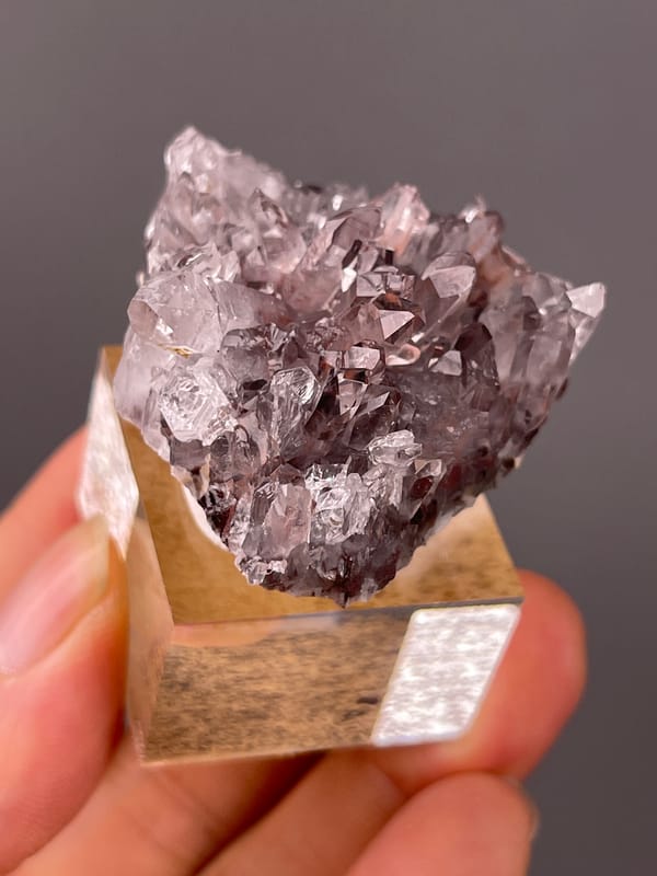 Hematite-Included Quartz specimen from Longyan, Fujian, China highlighting mauve quartz prisms with red inclusions
