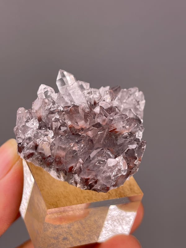 Hematite-Included Quartz specimen from Longyan, Fujian, China bearing mauve quartz prisms with red inclusions