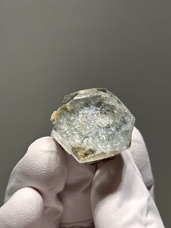 Hexagonal aquamarine with rainbow flash and mica from Xuebaoding, Sichuan, China