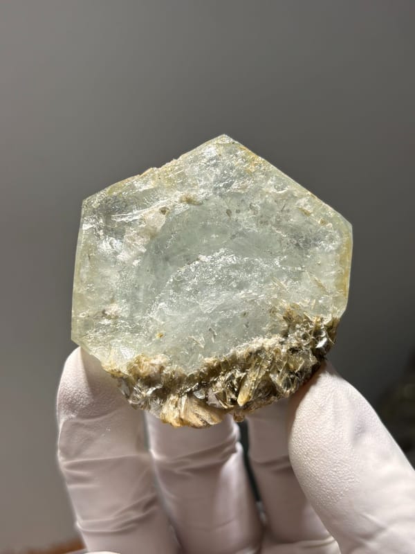 Hexagonal aquamarine plate with mica rosette from Xuebaoding, Sichuan, China, reverse side