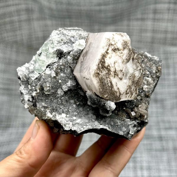 Hexagonal calcite with fluorite and quartz, from Fujian, China, front view in daylight, view 7 of 12