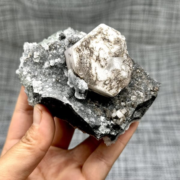 Hexagonal calcite with fluorite and quartz, from Fujian, China, front view in daylight, view 10 of 12